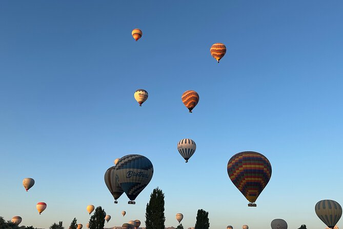 Cappadocia Sunrise Hot Air Balloon Watching Tour - Stop 3 toward Love Valley and Goreme Panorama: fairy chimneys plus balloons