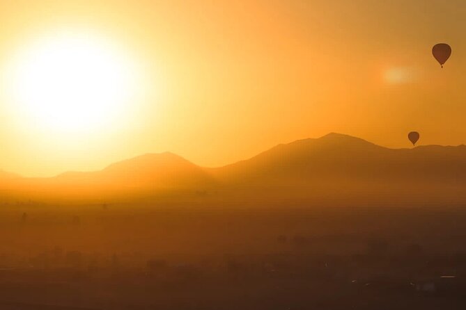 Hot air balloon flight in the desert with camel ride - Riding above the Atlas Mountains at sunrise