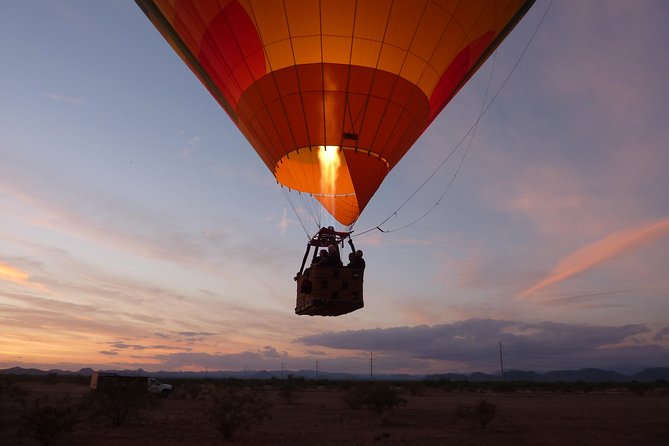 Phoenix Afternoon Hot Air Balloon Ride with Bubbly + Charcuterie - Landing in the desert: linens, china, champagne, and Vincent’s on Camelback