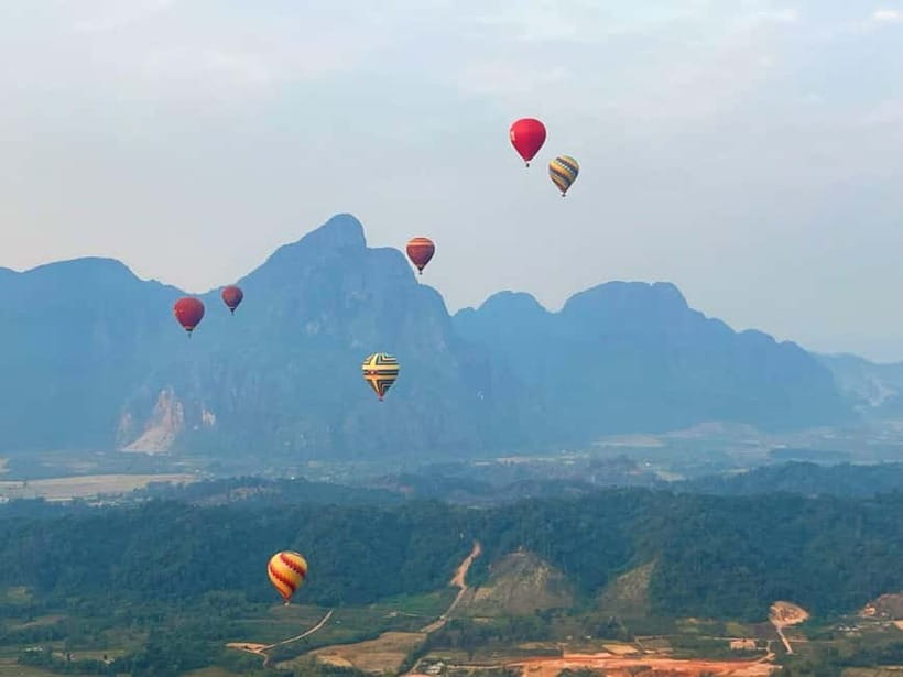 Vang Vieng: Hot Air Balloon Ride with City Hotel Pickup - Hotel pickup by tuk-tuk: sunrise and sunset timing that shapes your day